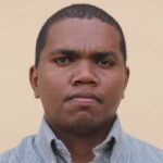 a headshot of a man in shirt