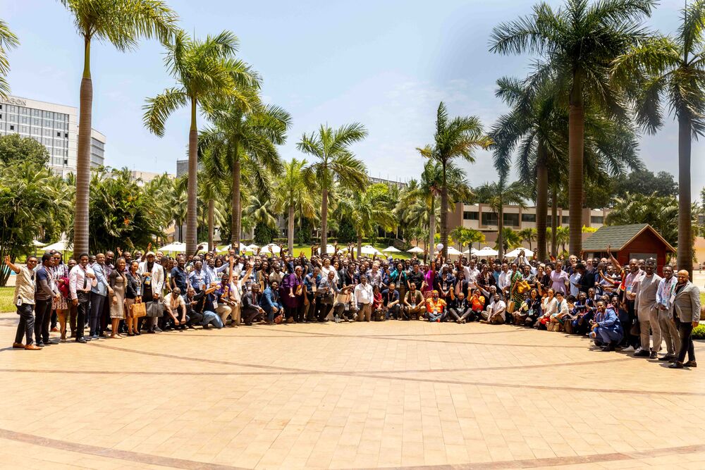 a group of people posing for a photo outdoors